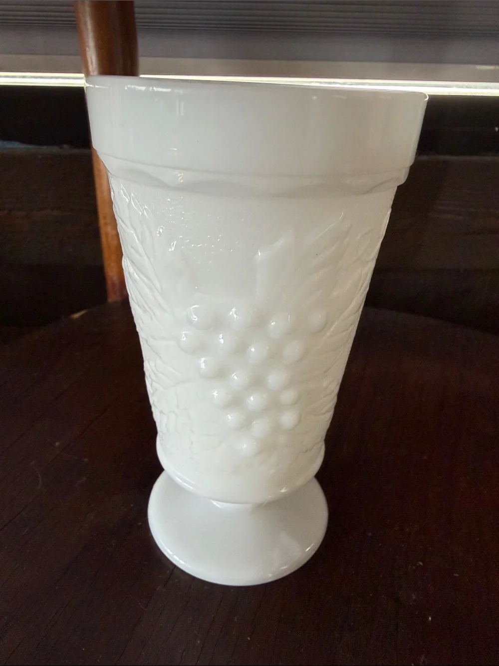 White milk, glass vintage goblet. Ceramic Pedestal Vase with Grape Relief
